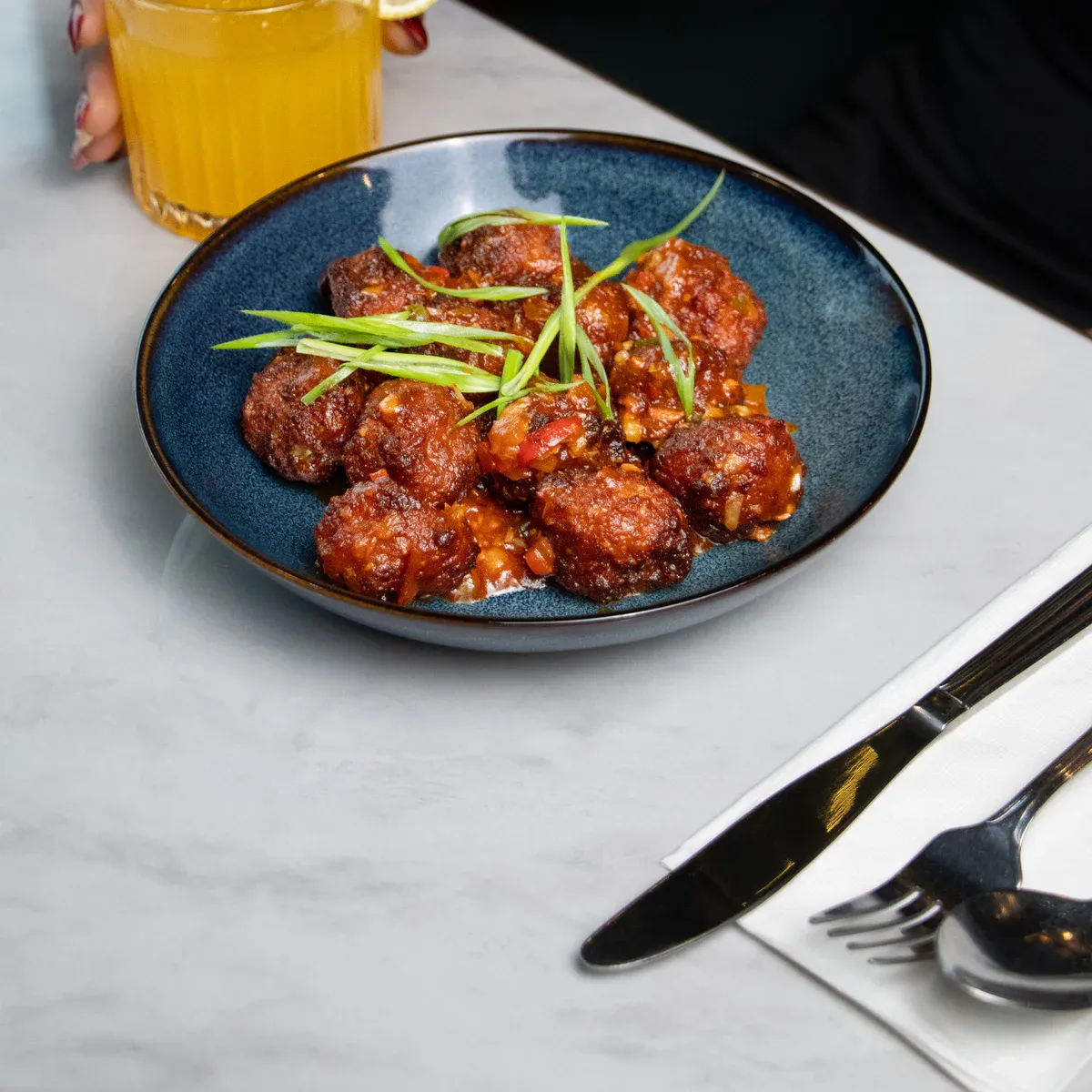 Batter-fried chicken with onions and peppers in spicy chili sauce.