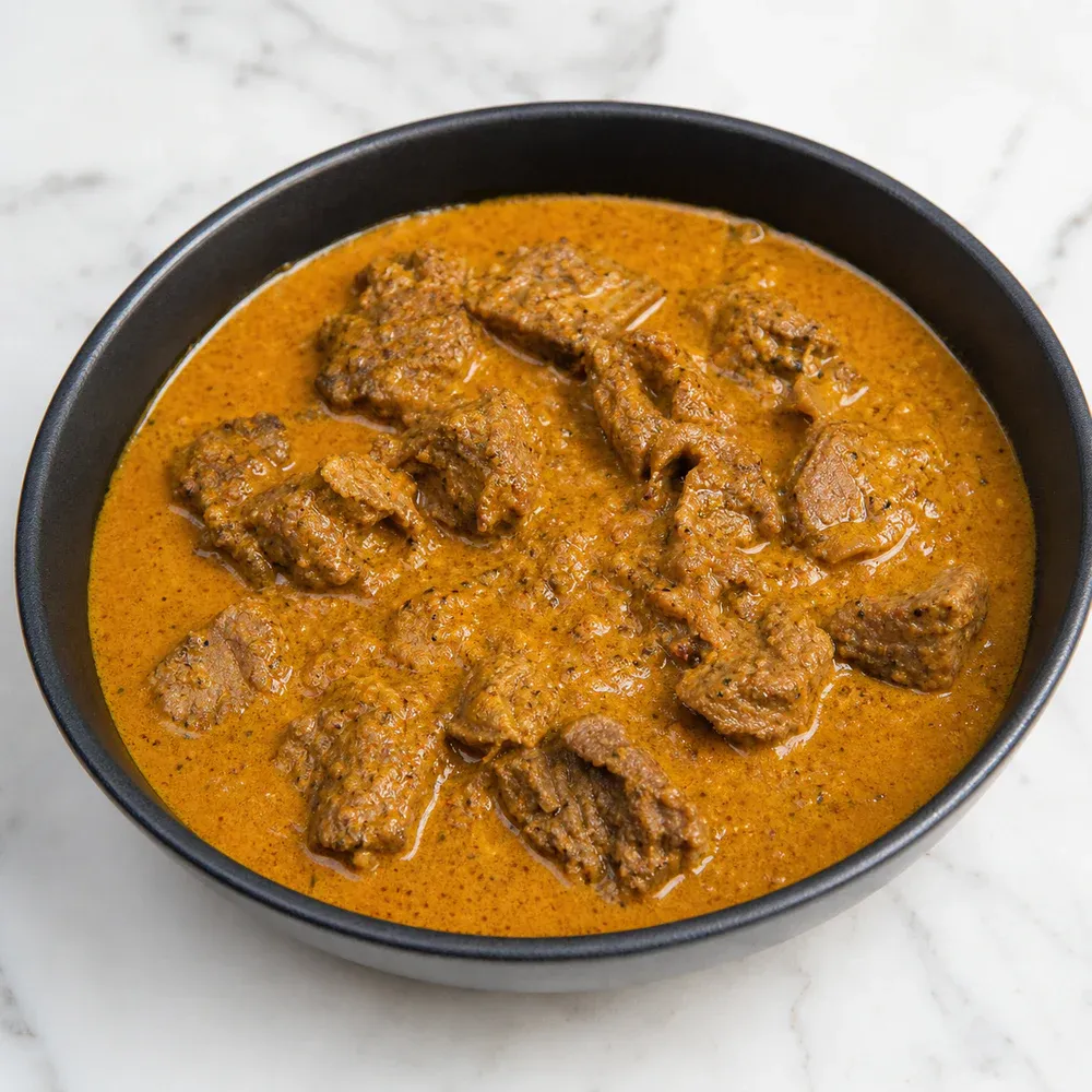 Boneless lamb cooked in a creamy coconut sauce.