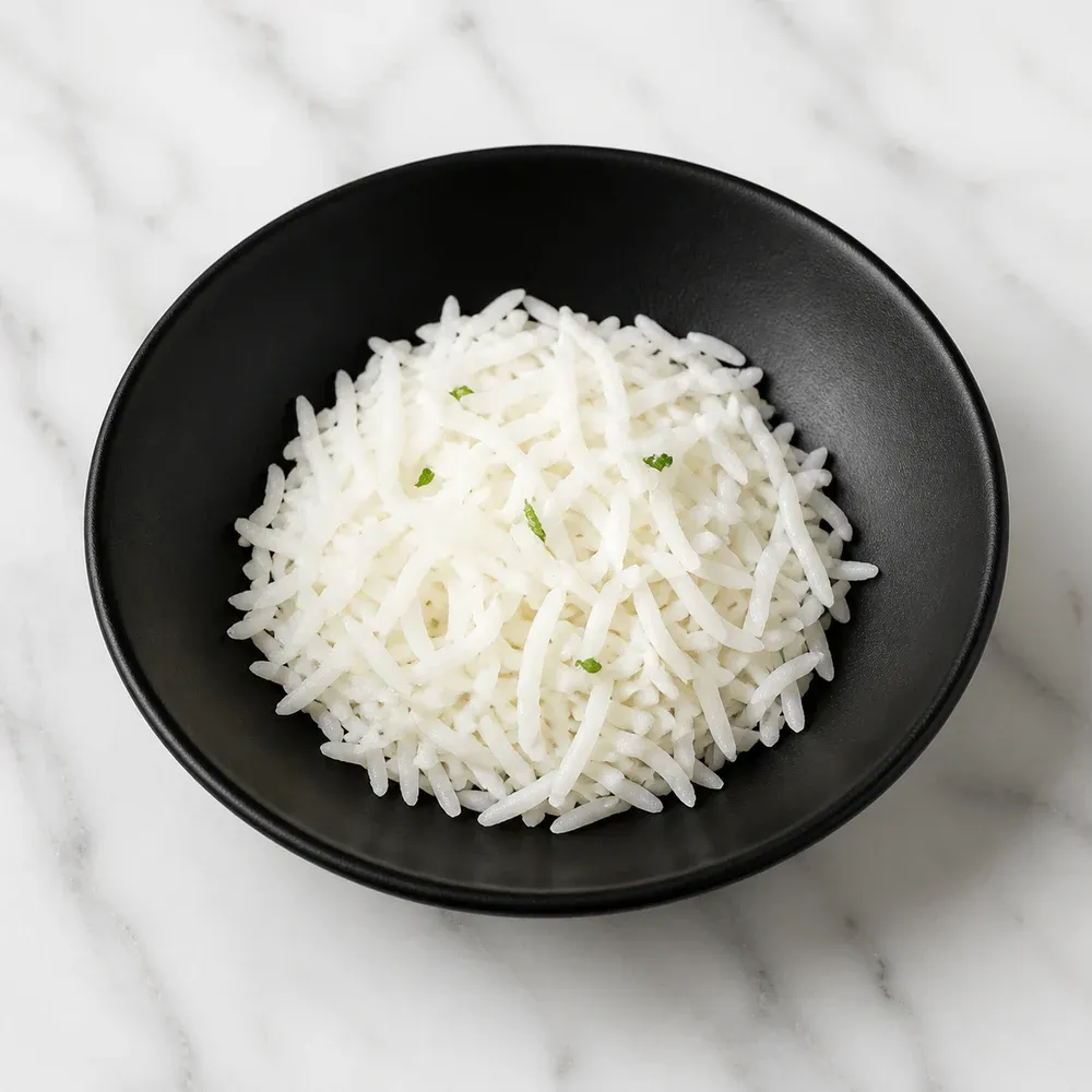A small portion of steamed basmati rice.